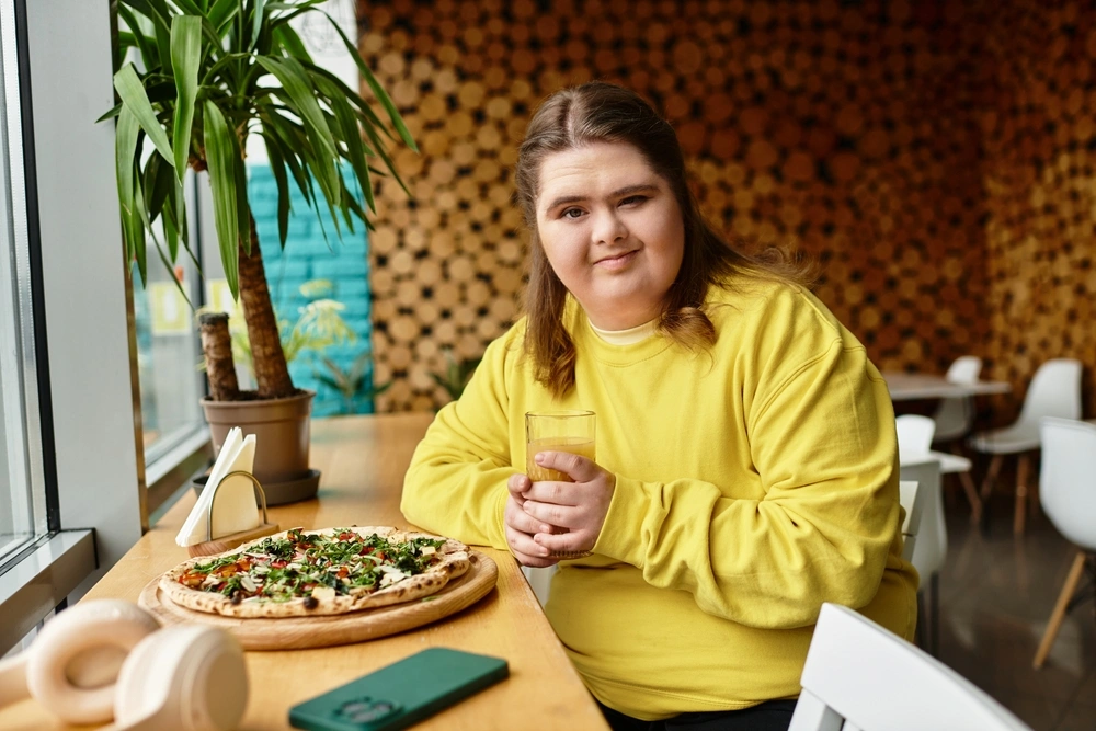 Disabled woman eating pizza